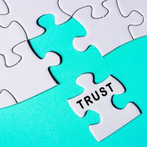 Puzzle piece with trust on it