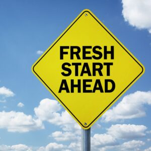 Sign with fresh start ahead on it