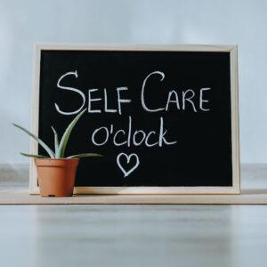 self care o'clock written on a chalk board