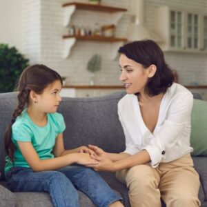 Mother talking to young daughter