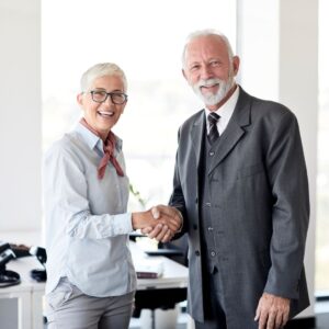 Woman and man shaking hands