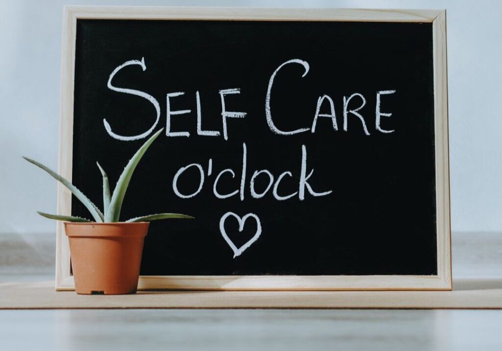 self care o'clock written on a chalk board