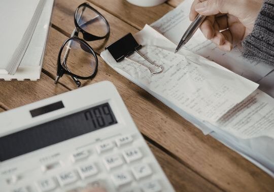 Person calculating bills