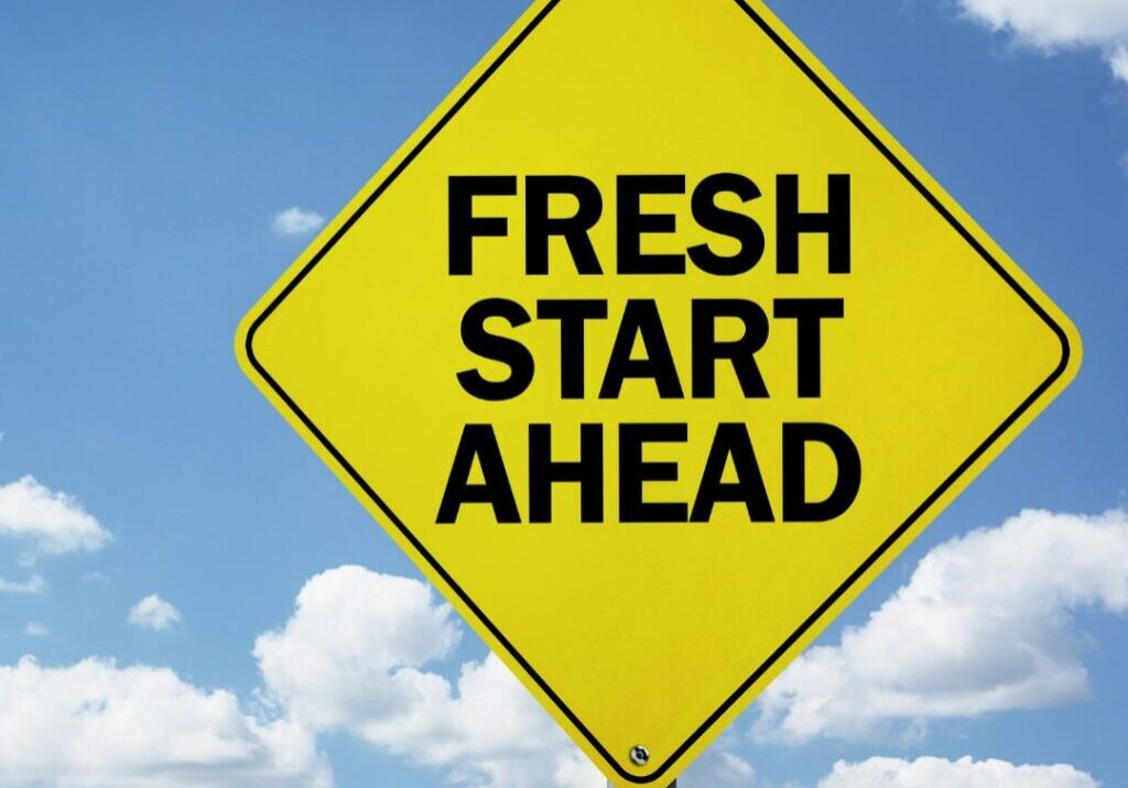 Sign with fresh start ahead on it