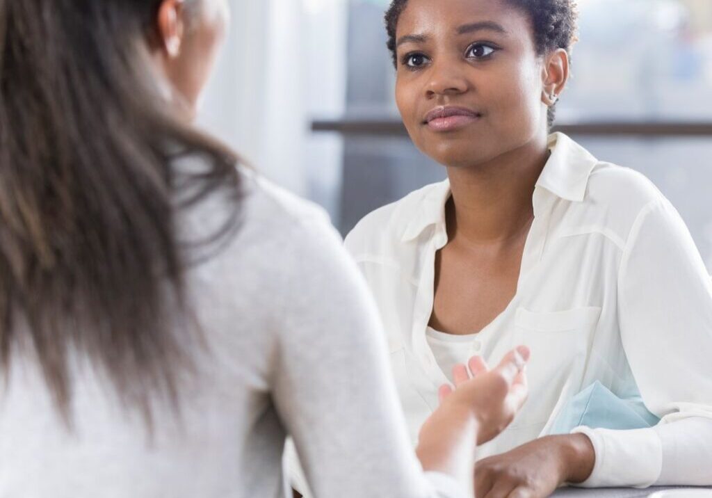 Woman talking to mental health professional